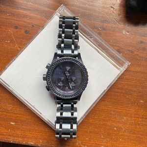 Nixon blue and metal gray. Blue crystals around blue face.